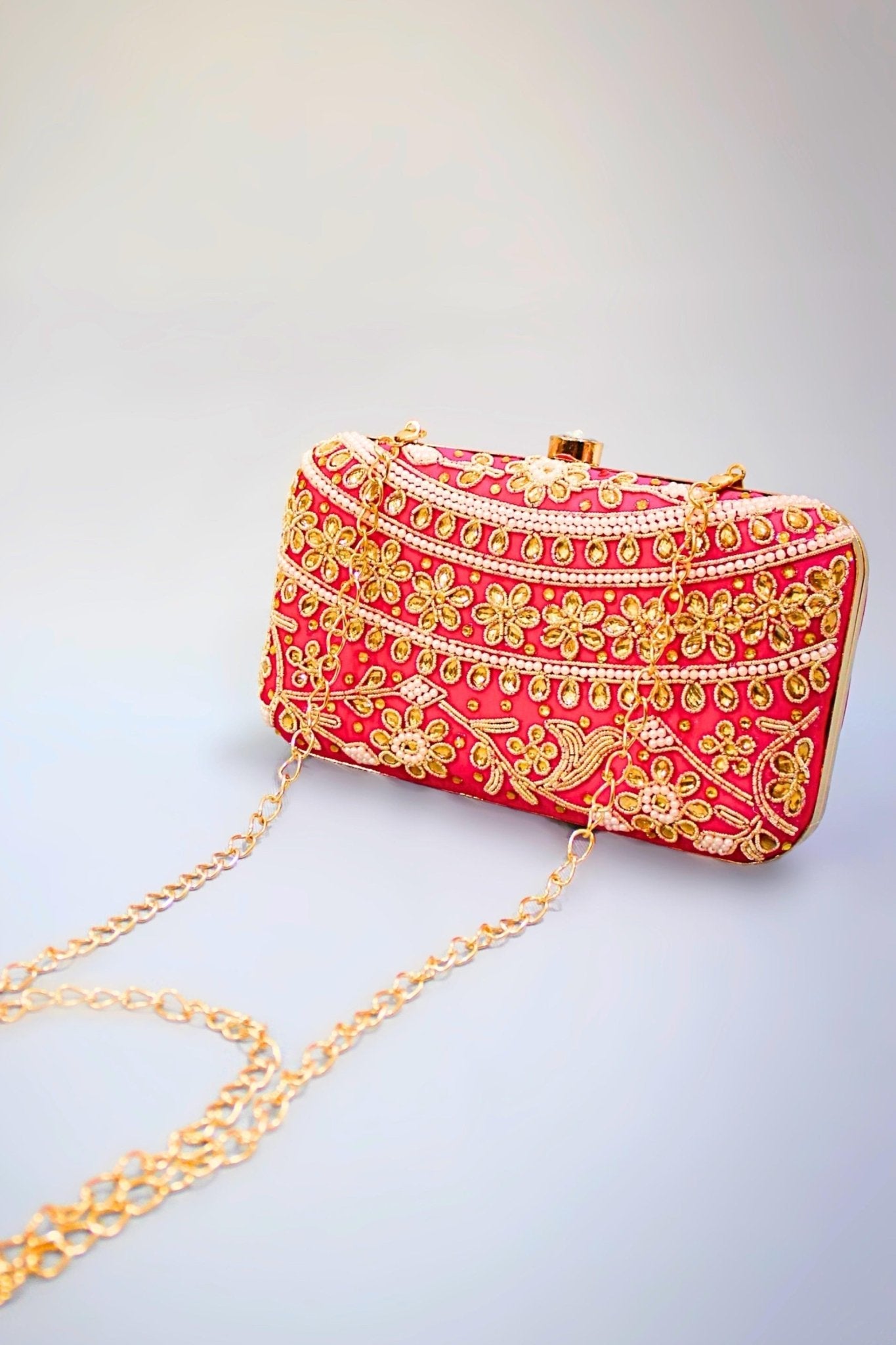 Pink gold clutch online bag