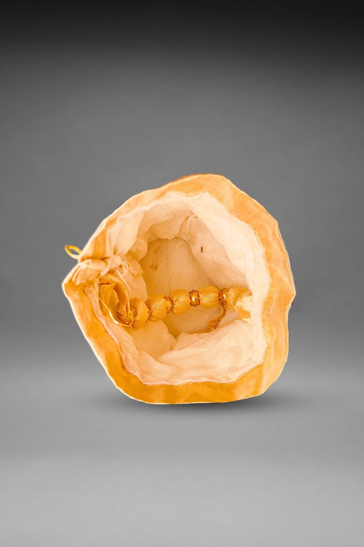 beige sequin potli bag