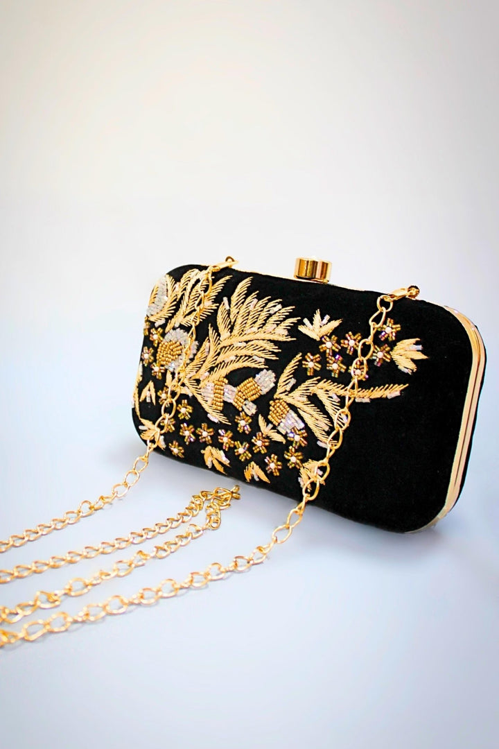 black and gold clutch