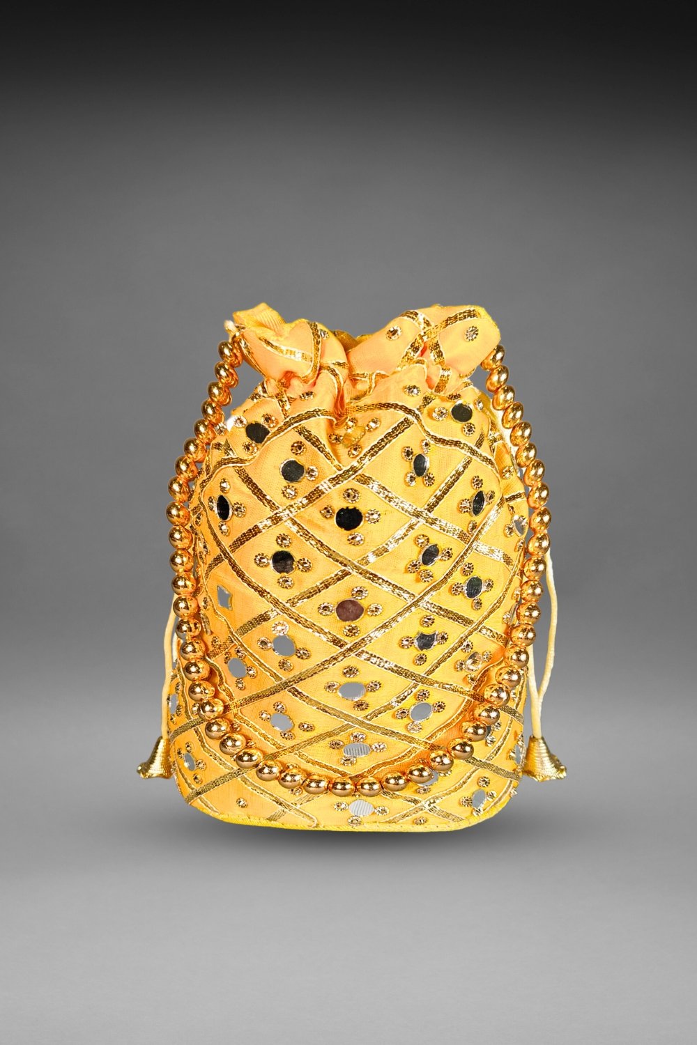 yellow mirror work potli bag